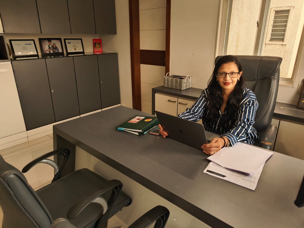 Ekta Ghetia providing expert counseling at her desk